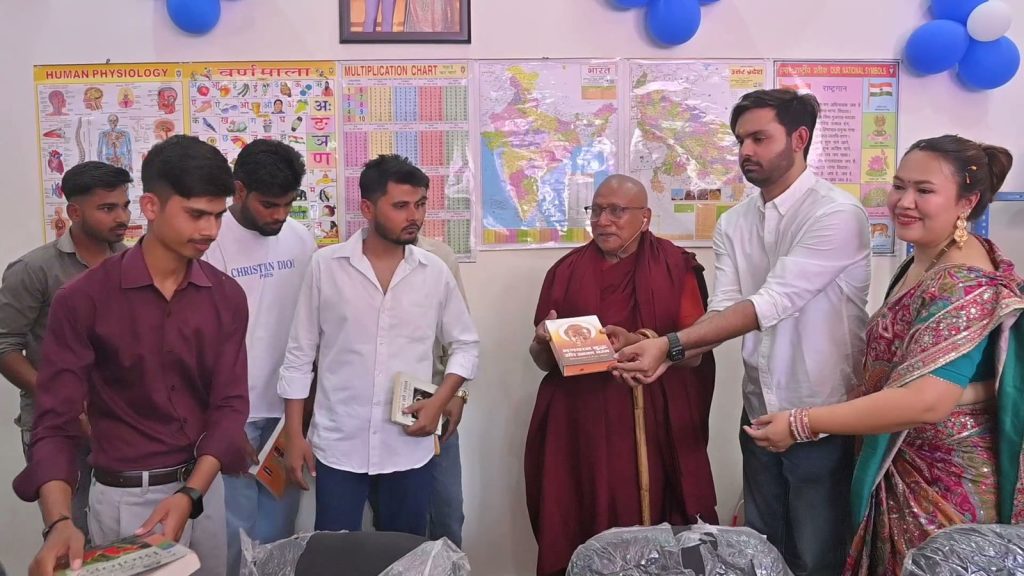 Students receiving books — library in use