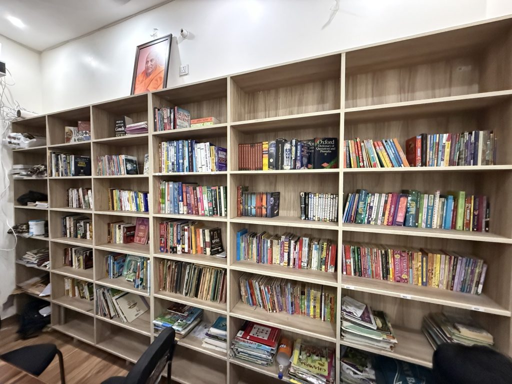 ★ Book wall (hero candidate A — warm)